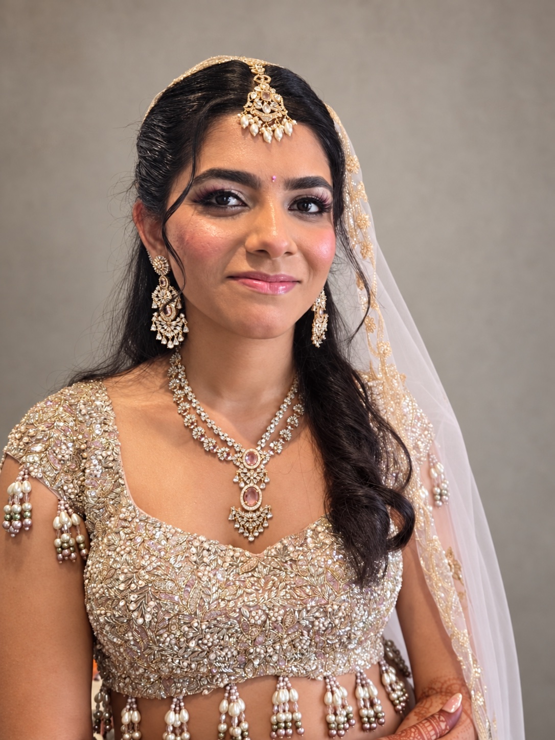 Bridal hair under a veil, styled by Sona