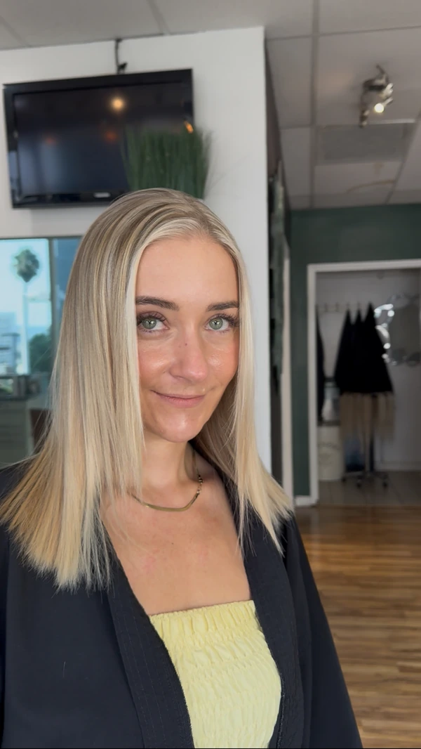 A straight blonde bob at shoulder length