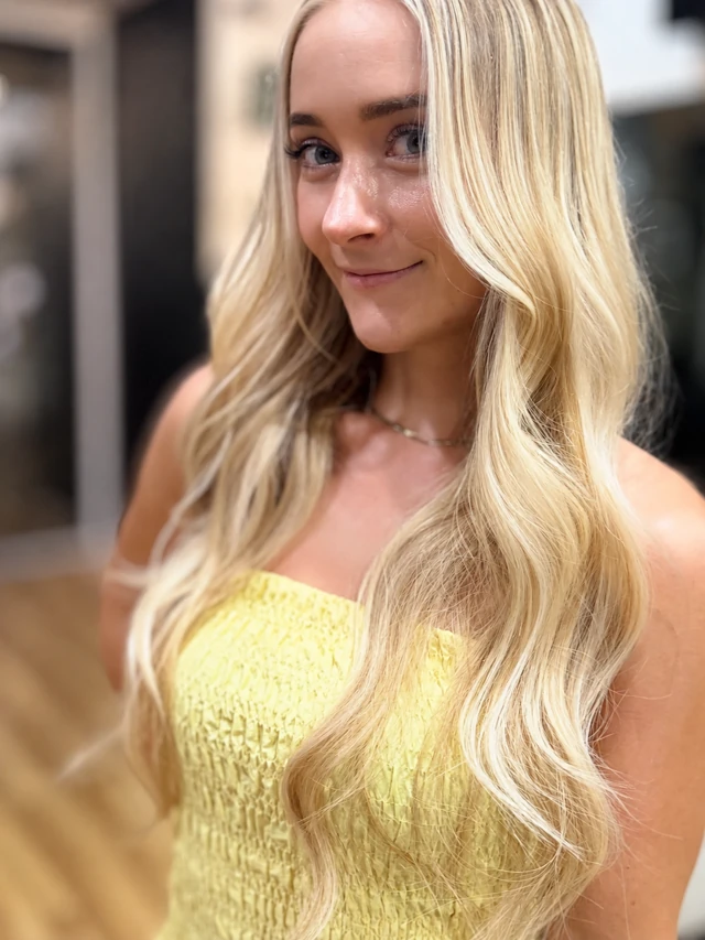 Blonde nano K-tip extensions with loose waves, photographed by Vered Salon
